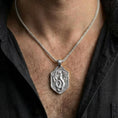 Load image into Gallery viewer, Polished silver fantasy coiled dragon shield necklace worn on chest highlighting medieval myth symbolism