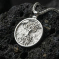 Load image into Gallery viewer, Polished silver sacred tree goddess pendant necklace displayed on volcanic stone background with flowing organic detail