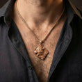 Load image into Gallery viewer, Rose gold plated Norse wolf pendant worn on model with masculine mythic warrior style