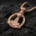 Load image into Gallery viewer, Rose gold plated Norse Mjölnir pendant necklace presented on volcanic rock surface with refined Viking myth aesthetic