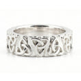 Load image into Gallery viewer, White Gold Celtic trinity knot band ring displayed on white surface as symbolic jewelry