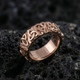 Load image into Gallery viewer, Rose gold Celtic knot eternity ring with repeating triquetra design on volcanic stone