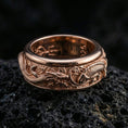 Load image into Gallery viewer, Rose gold plated dragon carp fidget ring presented on volcanic rock with premium mythic relief and tactile rotating comfort