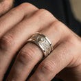 Load image into Gallery viewer, Polished silver lion emblem ring worn on hand emphasizing clean shine, crisp engravings, and refined statement styling