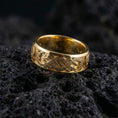 Load image into Gallery viewer, Gold plated Slavic dragon motif ring displayed on volcanic rock highlighting Celtic-style knot details and bold mythology aesthetic