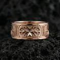 Load image into Gallery viewer, Rose gold plated medieval Maltese cross statement ring presented on volcanic rock surface, emphasizing antique-style relief work and premium handcrafted finish