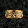 Load image into Gallery viewer, Gold plated Knights Hospitaller Maltese cross wedding band showcased on volcanic rock with heritage-inspired fleur de lis pattern and bold masculine profile