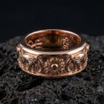 Load image into Gallery viewer, Rose gold plated elephant fidget ring presented on volcanic rock surface emphasizing bold animal pattern, heritage-inspired wedding band aesthetic