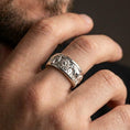 Load image into Gallery viewer, Polished silver spinning elephant band ring worn on hand highlighting clean shine, comfort fit profile, and tactile fidget movement for daily wear