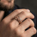 Load image into Gallery viewer, Rose gold plated floral spinner ring worn on finger delivering soft romantic tone, detailed rose engraving, and elevated bridal/anniversary look