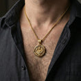 Load image into Gallery viewer, Gold plated Saint Uriel necklace pendant worn on neck, close-up lifestyle shot, luxury lighting with refined metallic highlights
