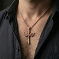 Load image into Gallery viewer, Rose gold plated Archangel Michael sword pendant necklace worn on neck, lifestyle composition with dark clothing, crisp winged sword silhouette