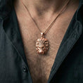 Load image into Gallery viewer, Rose gold plated lion head pendant necklace worn on neck, dark clothing lifestyle shot, lion head pendant centered and sharp