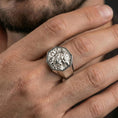 Load image into Gallery viewer, Octagon Foo Dog signet ring in polished silver finish on finger, crisp guardian lion details, natural lifestyle wear shot