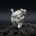 Load image into Gallery viewer, Sterling silver dragon turtle ring in polished silver finish on volcanic rock, intricate scales and shell engraving, close-up product photo