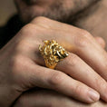 Load image into Gallery viewer, Medusa gorgon ring in a gold plated finish worn on finger, bold snake hair statement design, masculine lifestyle close-up