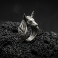 Load image into Gallery viewer, Sterling silver Anubis ring in an oxidized finish on volcanic rock, jackal-headed Egyptian god with Eye of Horus side engraving, dramatic macro product shot