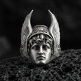 Load image into Gallery viewer, Sterling silver Hermes ring in an oxidized finish on volcanic rock, Greek god face with winged helmet relief, dramatic macro studio shot