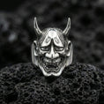 Load image into Gallery viewer, Hannya demon ring in polished silver finish on volcanic rock, sharp horn details and glossy highlights, premium close-up product photo