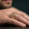 Load image into Gallery viewer, Tree of Life signet ring lifestyle photo, rose gold plated symbolic ring for men, heritage-inspired statement look