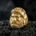 Load image into Gallery viewer, Gold plated Hephaestus signet ring on volcanic rock, bold blacksmith god portrait ring with strong artisan aesthetic