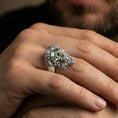 Load image into Gallery viewer, Polished silver Zeus ring on finger showcasing detailed beard and laurel wreath relief, clean lifestyle wear photo with natural lighting