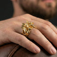 Load image into Gallery viewer, Gold plated Minotaur signet ring worn on finger, statement mythology jewelry inspired by ancient Greek legends, premium lifestyle close-up