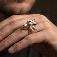 Load image into Gallery viewer, Rose gold plated dragon ring on finger featuring textured wyrm scales and horned head detail, refined fantasy jewelry lifestyle wear shot