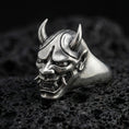 Load image into Gallery viewer, Oxidized sterling silver Oni mask signet ring on black volcanic stone, Japanese demon face with horns and fangs, gothic biker style
