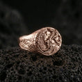 Load image into Gallery viewer, Rose gold plated wolf and dragon ring on black volcanic stone, mythical wolf dragon motif, statement fantasy ring