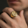 Load image into Gallery viewer, Gold plated dragon signet ring worn on a human finger, medieval fantasy dragon emblem, luxury signet ring