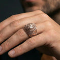 Load image into Gallery viewer, Rose gold plated alien skull ring on a human finger, biomechanical gothic skull design, sci-fi fashion ring