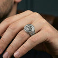 Load image into Gallery viewer, Polished sterling silver Flying Dutchman ship signet ring on a human finger, engraved maritime vessel design, sailor jewelry