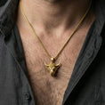 Load image into Gallery viewer, Gold plated bull head necklace pendant worn on a human neck, Taurus zodiac horned bull charm, braided chain