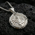 Load image into Gallery viewer, Polished silver Saint Gabriel medallion necklace on dark volcanic stone, crisp angel figure detail and ornamental border, close-up shot