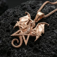 Load image into Gallery viewer, Rose gold plated dragon pentagram pendant on matte volcanic stone, intricate scale texture and wing relief on star frame, sharp macro focus