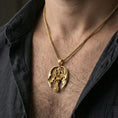 Load image into Gallery viewer, Gold plated dragon cross pendant necklace worn on neck, premium lifestyle composition, gothic medieval cross centerpiece with dragon wrap