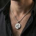 Load image into Gallery viewer, Polished silver Mortal Kombat dragon necklace worn on neck, clean lifestyle close-up highlighting dragon emblem and circular frame