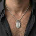 Load image into Gallery viewer, Polished silver Serbia crest pendant on model, clean crowned emblem and shield medallion necklace styling