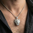 Load image into Gallery viewer, Polished silver Chinese dragon head necklace worn on neck, fierce dragon face pendant centered, clean lifestyle crop