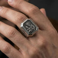 Load image into Gallery viewer, Oxidized sterling silver St Joseph signet ring worn on finger, octagon face saint relief, Catholic mens jewelry close-up