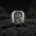 Load image into Gallery viewer, Polished silver St Christopher ring on porous volcanic stone, detailed saint engraving with staff, Catholic signet macro