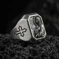 Load image into Gallery viewer, Oxidized sterling silver Jesus Christ signet ring on volcanic rock, prayer scene relief, cross shoulder engraving