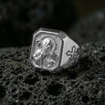 Load image into Gallery viewer, Polished silver Saint Benedict ring on porous volcanic stone, halo relief carving, Christian protection jewelry