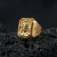 Load image into Gallery viewer, Gold plated Jesus Christ signet ring on dark volcanic rock, halo portrait relief, cross side accents