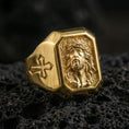 Load image into Gallery viewer, Gold plated Jesus Christ signet ring on dark volcanic rock, crown of thorns relief, cross shoulder detail close-up