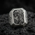 Load image into Gallery viewer, Oxidized sterling silver Jesus Christ crown of thorns ring on volcanic rock, side-profile Christ relief, cross shoulder engravings