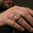 Load image into Gallery viewer, Rose gold plated St George dragon slayer ring worn on finger, ornate framed signet style, unique faith gift jewelry