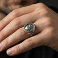Load image into Gallery viewer, Oxidized 925 sterling silver Sacred Heart signet ring worn on finger, flaming heart and cross emblem, Christian devotion ring
