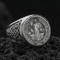 Load image into Gallery viewer, Oxidized 925 sterling silver St Benedict medal signet ring on volcanic rock, Latin prayer seal detail, Catholic protection ring